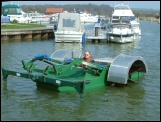 weed cutting boats paddle or auger driven